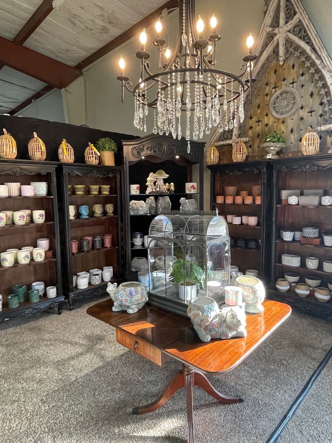 Shelves of ceramic pottery inside the store