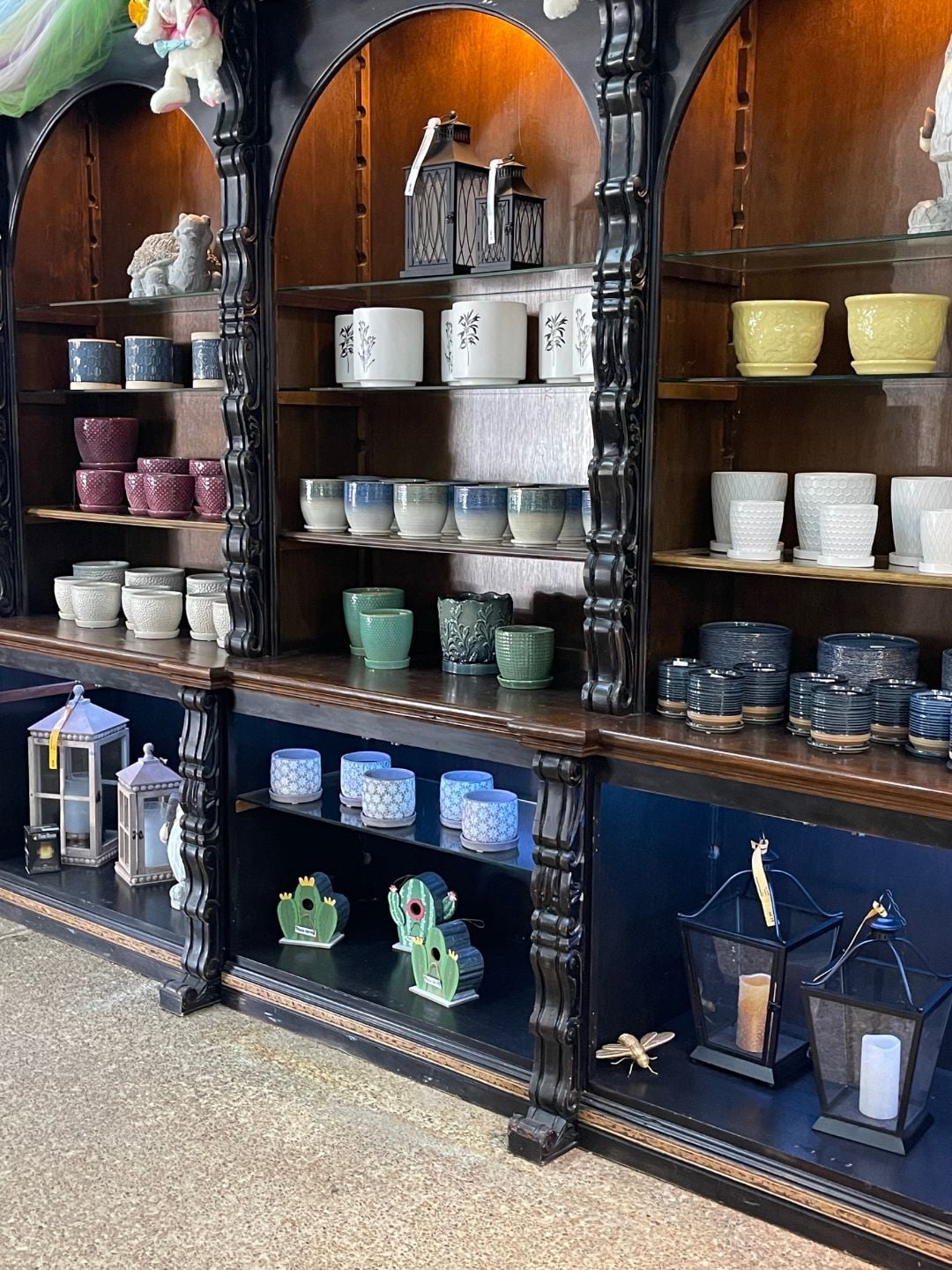 Ceramic pots displayed on shelves