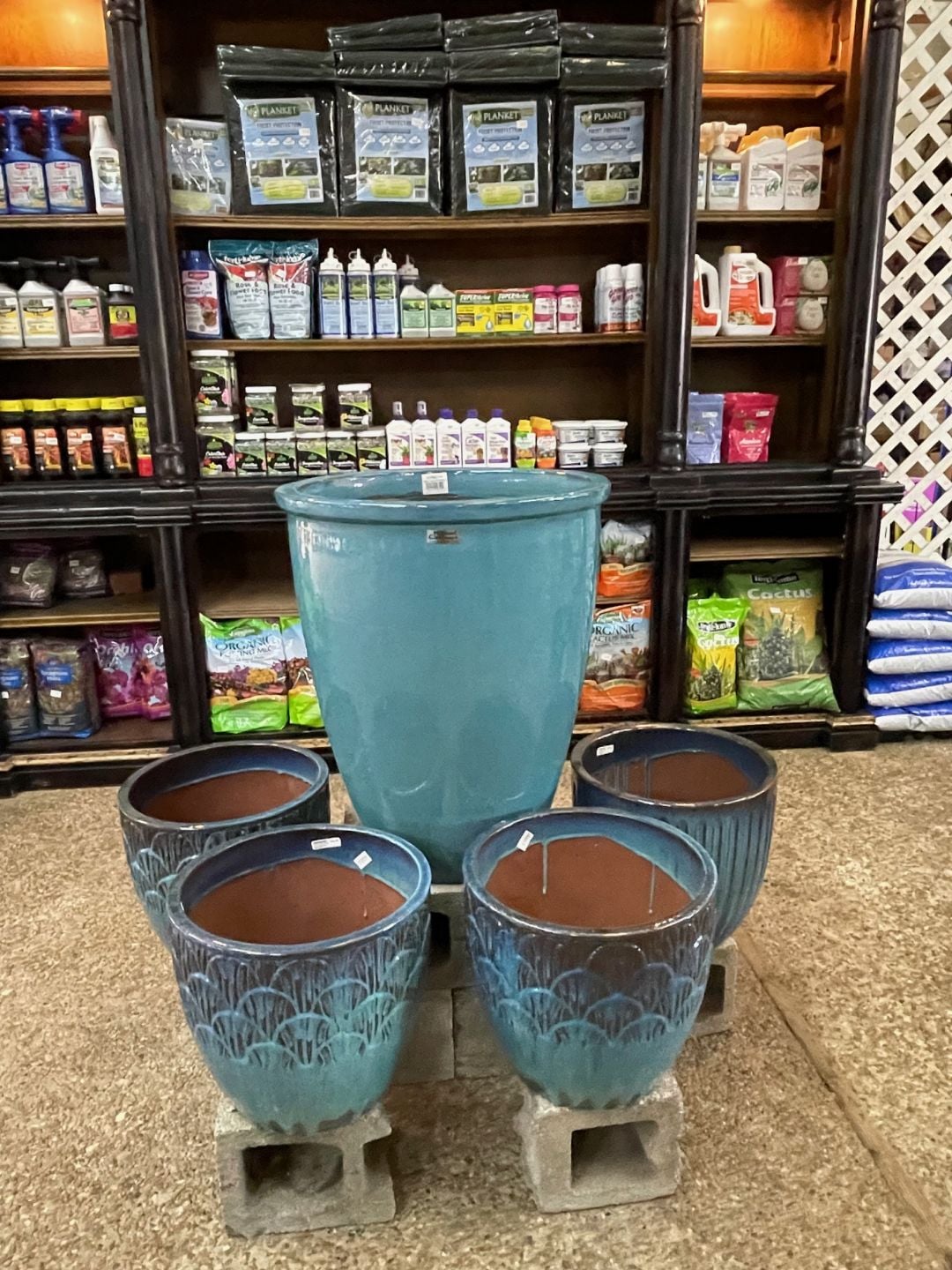 Garden supply shelves with soils and plant care products