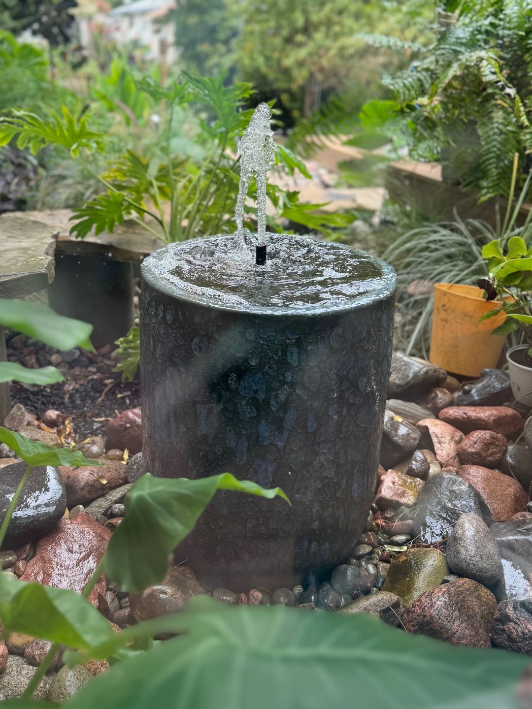 Close view of an urn fountain made from a glazed pot
