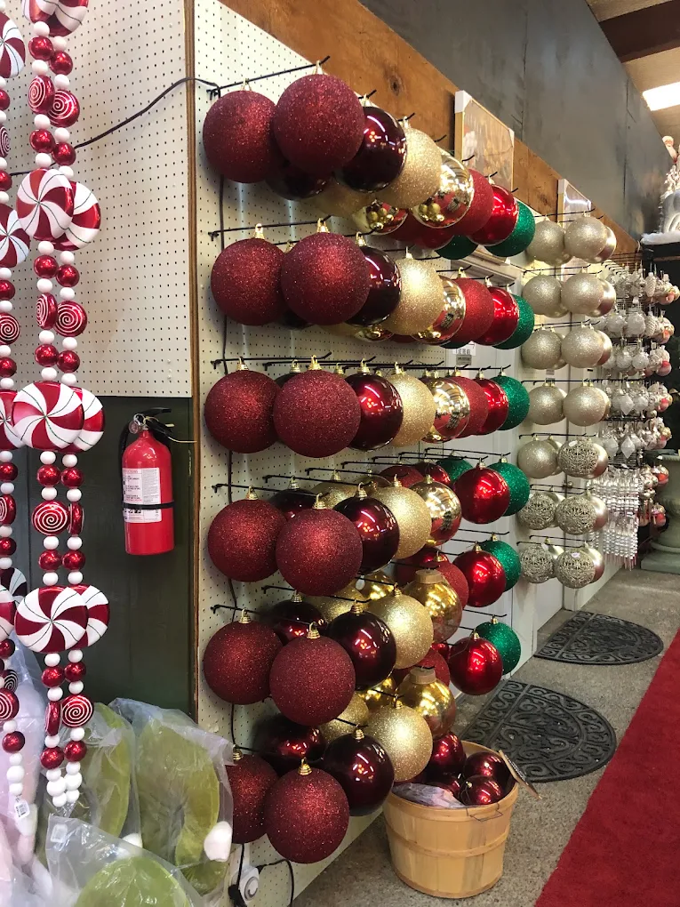 A wall of red and silver ornaments at Candy Cane Corner