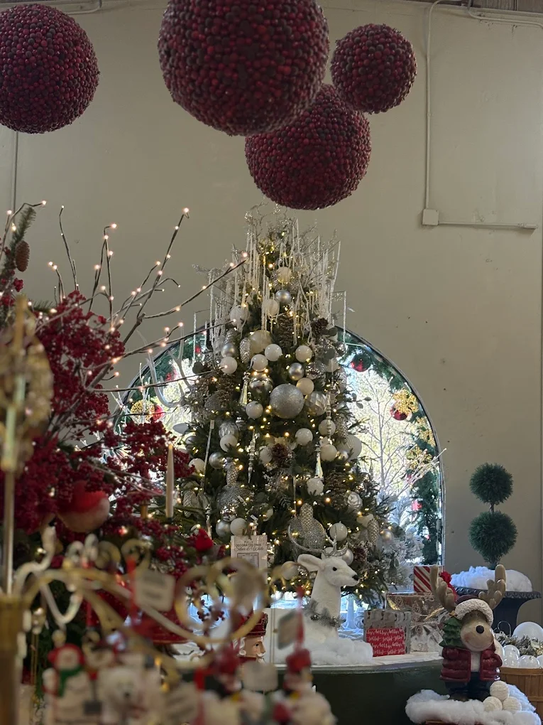 A dressed tree reflected in a mirror at Candy Cane Corner